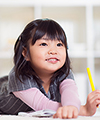 Child playing with pencil colors