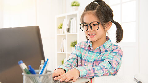 Child learning on computer